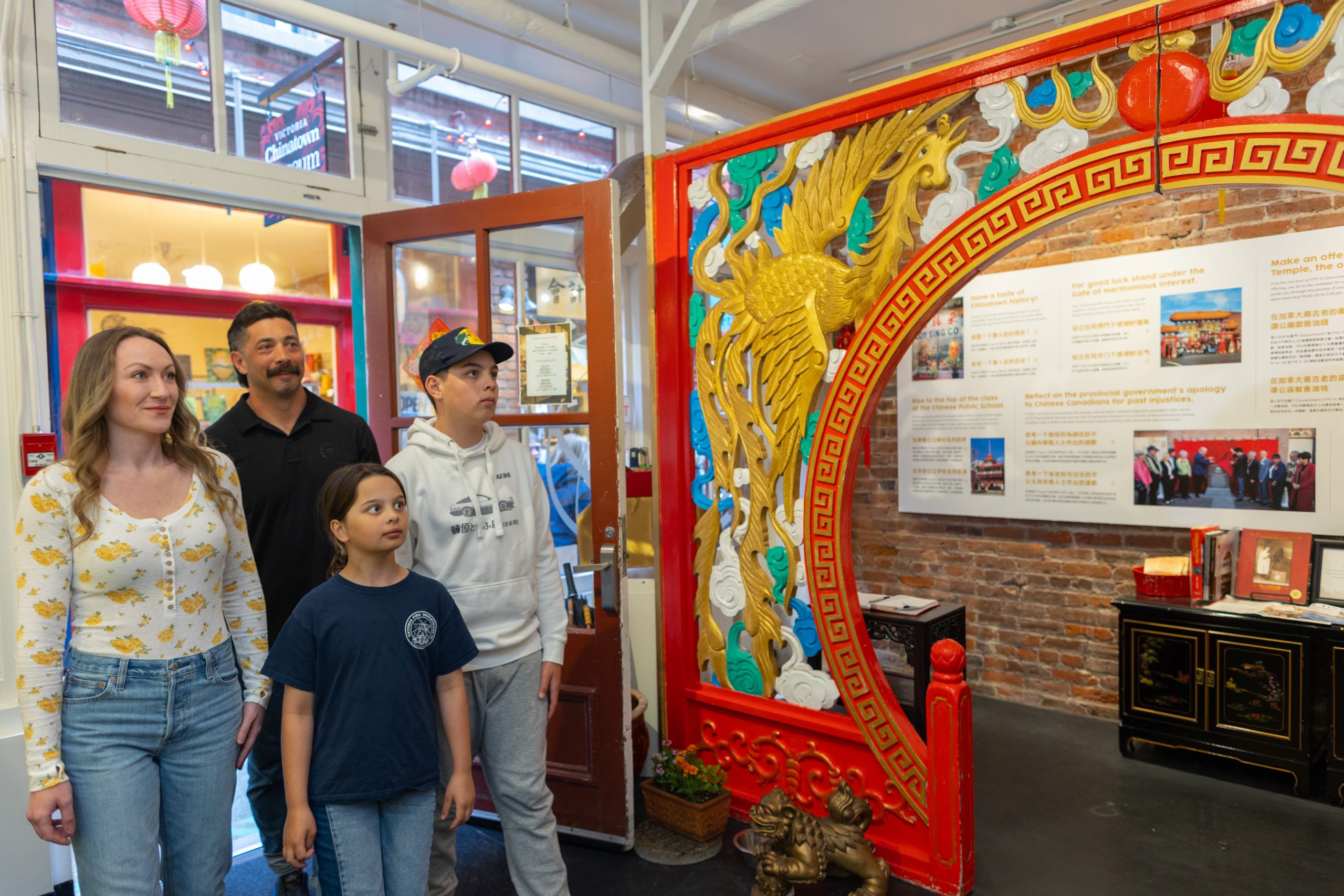 family with two kids enter the Victoria Chinatown Museum